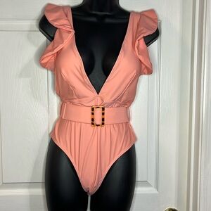 Avanova peach colored one piece swim suit, size medium, NWT.